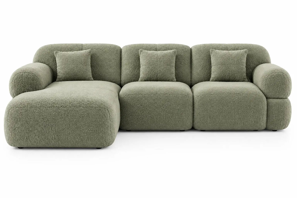 Sofá esquinero tapizado de contorno redondeado, verde